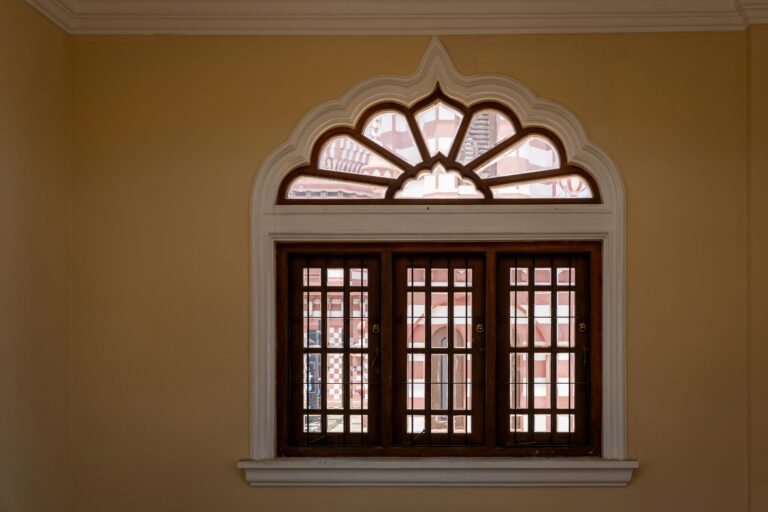 Elegant wooden arch window with decorative Islamic architecture in Colombo, Sri Lanka.